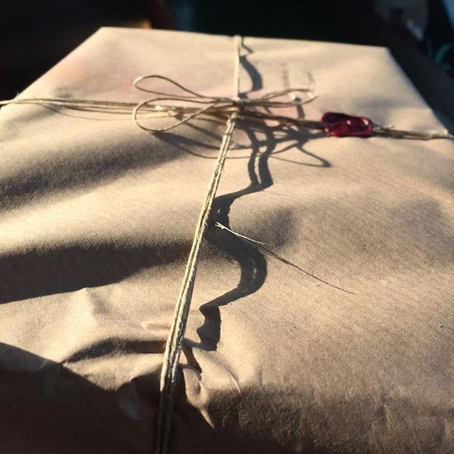Package with strings and wax seal